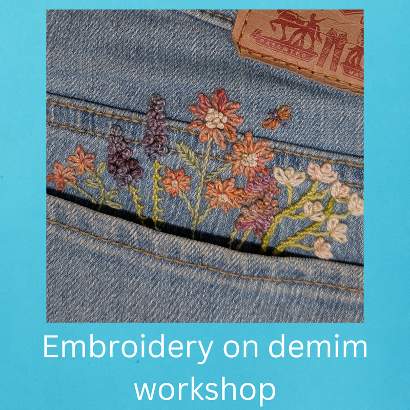 Embroidered floral design on denim fabric with a workshop text overlay.