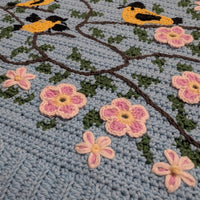 Tapestry crochet & surface decoration | Maud Lewis Yellow Birds sweater