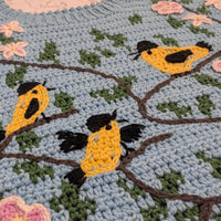 Tapestry crochet & surface decoration | Maud Lewis Yellow Birds sweater